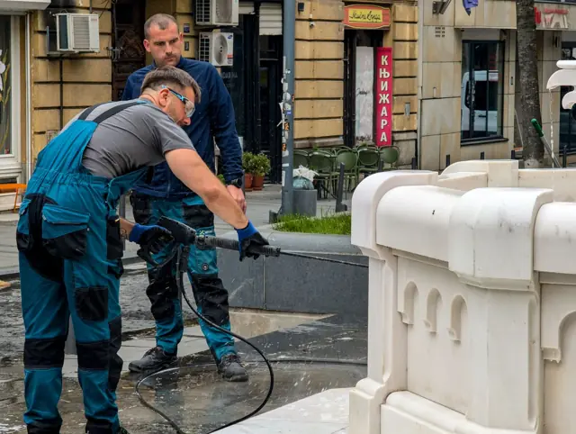 Two Spraydaddys technicians pressure washing outdoor surfaces
